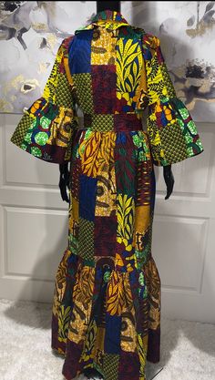 The KEMI African Print Maxi Dress is the perfect dress for any occassion, including holiday parties. A beautiful Ankara patchwork print dress that will make you look stunning. Be ready for all the compliments!  Look Unique. Know You Are Beautiful. Available in sizes S-2XL Yellow, Maroon, Blue, Green, And Black In Color Ankara Patchwork Print  Tiered Dress Ruffled Shirt Colar Ruffled Sleeves  Ruffled Hem Cloth Belt CARE Hand Wash Or Machine Wash On Cool Gentle Cycle. Line Dry, Steam Iron. Fitted Green Maxi Dress For Holiday, Fitted Midi Dress With Patchwork, Patchwork Midi Dresses For Party, Party Midi Length Patchwork Dresses, Midi Length Patchwork Dress For Party, Fitted Green Maxi Dress With Patchwork, Traditional Yellow Maxi Dress For Party, Fitted Yellow Patchwork Dress, Elegant Multicolor Patchwork Dress