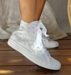 "Stunning bridal Converse, embellished with romantic ribbon lace for your perfect day, Personalised wedding shoes for the wedding day and beyond. Custom Converse with the option to add a perfectly colour matched ribbon. - Upper piece of durable canvas fabric - Classic toe cover made of cast rubber sole - All Star logos on the back of the sole and the inside - They are tied at the highest point of the shoe, flattening the foot inside the shoe Tip: Converse's size is a smaller number than other co Round Toe Wedding Shoes With Laces, Round Toe Lace Wedding Shoes, Lace-up Lace Wedding Shoes, White Lace Wedding Shoes For Bride, White Round Toe Wedding Shoes For Destination Wedding, Lace-up Wedding Shoes With Laces, White Lace-up Lace Wedding Shoes, White Lace-up Wedding Shoes For Bridal Shower, Round Toe Wedding Shoes With Laces For Bridal Shower