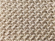 the texture of an upholstered carpet is shown in beiges and browns,