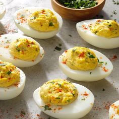 deviled eggs are arranged on a white plate