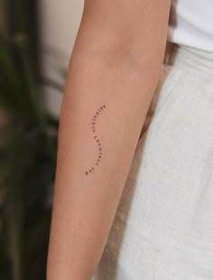 a person with a small tattoo on their arm