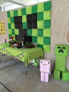 a table that has some green and black decorations on it, along with other items