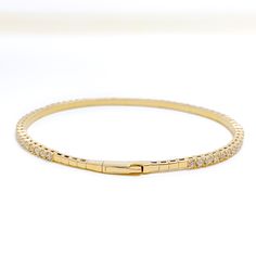 Indulge in the ultimate luxury with our Classy Striking Diamond Bangle Bracelet. Crafted with 18k Yellow Gold and adorned with 1.93ct round brilliant cut diamonds in F-G color and VS quality, this bangle bracelet is a timeless piece that will elevate any outfit. With a weight of 8.1 grams, it features a push lock that makes it easy to wear and take off. Add this exquisite piece to your jewelry collection today. PRODUCT DETAILS Gold Purity(karat): 18k Item Weight(grams): 8.1 Item Finish: Yellow G Hand Set Diamond Bangle For Everyday Luxury, Diamond Gold Bangle Bracelet For Everyday Luxury, Everyday Luxury Diamond Gold Bangle Bracelet, Diamond Tennis Bracelet With Single Cut Diamonds, Luxury Gold Bracelet With Prong Setting In White Gold, Timeless Hand-set Diamond Bangle Bracelet, Luxury Diamond Bangle Bracelet With Prong Setting, Yellow Gold Diamond Bangle With Brilliant Cut, Timeless Brilliant Cut Diamond Bangle Bracelet