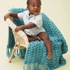 a small child sitting on top of a chair