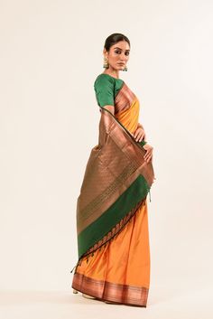 Discover the elegance of our Mustard Yellow Kanjeevaram Silk Saree, featuring intricate Mayil butas in pure gold Zari. This handwoven masterpiece comes with a green and gold border, adorned with Zari detailing. South Indian Silk Saree, Baluchari Saree, Silver Blouse, Saree Blouse Styles, Orange Saree, Net Blouses, South Indian Sarees, Cotton Gowns, Multi Color Blouse