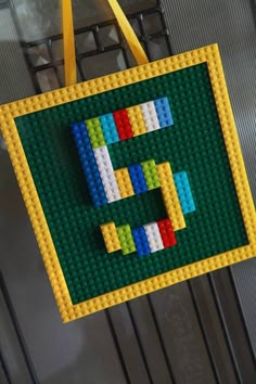 a lego tote bag hanging on a wall