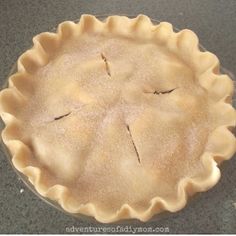 an uncooked pie sitting on top of a counter