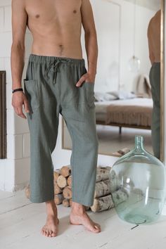 "Culottes linen pants for men to fill a gap in their everyday wear. They are breathable and durable to provide maximum comfort for wearing them on yoga exercise or just like loungewear.. The lounge style is redefined with straight-leg drop and cropped length. They have two side pockets and the drawstring closure. Elastic band on the waist and drawstrings makes the pants feel comfortable and stylish in everyday wear. Available in various colors and free to experiment with different styles and the Summer Tapered Leg Cargo Pants For Loungewear, Summer Tapered Leg Cargo Lounge Pants, Summer Tapered Leg Bottoms With Drawstring, Summer Ankle-length Cargo Pants With Drawstring, Relaxed Trousers With Pockets, Summer Ankle-length Cargo Pants For Loungewear, Summer Cropped Leg Pants With Pockets, Casual Cropped Harem Pants With Pockets, Summer Loungewear Cargo Pants