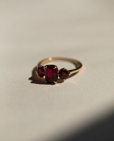 Red Ruby Diamond Ring, Three Stone Gemstone Ring, Elongated Cushion & Round Cut Engagement Ring, Past Present Future Wedding Ring, 14K Gold Item Description: Stone - Simulant Diamond Stone Shape - Elongated Cushion & Round Cut 1. White Gold: 10K/14K/18K 2. Yellow Gold: 10K/14K/18K 3. Rose Gold: 10K/14K/18K 4. Silver: Sterling Silver 925 Size Customization: What Size you want... * You can also Customize ring size in US 4 to US 12! It sometimes affects to price. * Main Stone & Shape Customization: Luxury Dainty Round Ruby Ring, Antique Ring Round Stone, Antique Ruby Ring Stone, Raw Ruby Engagement Rings, Engagement Ring With Small Ruby, Solid Gold Rings With Stone, Vintage Gold Rings Rose, Big Stone Rings Simple, Deep Set Stone Ring