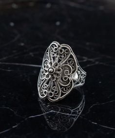 Sterling Silver Boho Filigree Lace Women Ring, Artisan Handmade Floral Statement Ring, Handmade Ornate Goth Jewelry, Birthday Gift for Her Anniversary Gift, Dainty Nature Jewelry Ring, Garden ring, victorian flower ring, women statement ring, ring gift for mom Material: 925 Sterling Silver ( NICKEL FREE ) FAST AND TRACKABLE SHIPPING FOR ALL EU COUNTRIES AND USA. COMES WİTH VELVET POUCH AND LUXURY GİFT BOX. The Sterling Silver Boho Filigree Lace Women Ring you mentioned sounds like a beautiful and intricate piece of jewelry. It is described as an artisan handmade floral statement ring with ornate gothic elements, making it a unique and stylish choice. This type of ring is often associated with bohemian and boho-chic fashion styles, characterized by a free-spirited and eclectic aesthetic. Th Handmade Vintage Filigree Ring, Bohemian Filigree Ring As Gift, Vintage Oxidized Filigree Ring Gift, Bohemian Filigree Ring With Oxidized Finish As Gift, Handmade Bohemian Filigree Adjustable Ring, Artistic Jewelry With Intricate Design For Gift, Handmade Adjustable Bohemian Filigree Ring, Bohemian Filigree Ring As A Gift, Handmade Ornate Filigree Wedding Ring