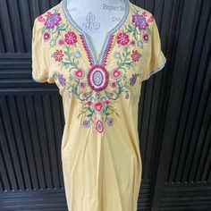 Beautiful Cotton Dress In A Light Yellow With Bright Embroidery. Comfy And Great To Throw On And Go. 34 Long And About 19 Bust Laid Flat. Nwt. Yellow Embroidered V-neck Dress, Yellow Floral Embroidered Dress, Yellow Floral Embroidered Dress For Spring, Casual Yellow Dresses With Floral Embroidery, Casual Yellow Dress With Floral Embroidery, Yellow Bohemian Dress With Floral Embroidery, Yellow Embroidered Summer Dress, Yellow Summer Embroidered Dress, Embroidered Yellow Beach Dress