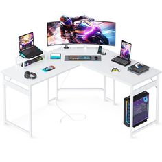 a computer desk with three monitors and two laptops on top of it, all connected to one another