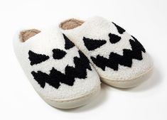 Step up your slipper game with these adorable Black & White Pumpkin Slippers! Made of soft and cozy fabric with a rubber sole, these snazzy slip-ons make a statement while keeping your feet warm. Perfect for fall festivities or just lounging around the house! Great for all genders. Details: Plush Top Sizes: 6-11 Color: black outside and pink inside. Sole: Rubber Material: Faux Fur, Fleece Lining Use: Perfect all-day use around the house. Care: Spot clean and air/hang dry. Pumpkin Slippers, Fall Festivities, Cozy Fabric, White Pumpkins, Loungewear Sets, Custom Tees, Fall Festival, Rubber Material, Car Decor