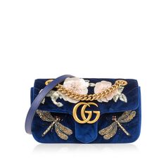 The It-Bag of all It-Bags, Gucci presents its highly-acclaimed GG Marmont flap bags - perhaps the most popular and in-demand handbag of the past 5 years. Designed by Alessandro Michele, this particular piece is crafted from luxurious royal blue velvet and features stunning sequin-embellished bees and flowers. Not your ordinary Marmont, the precise detailing makes this bag unique and s that you won't see on the shoulder of just anyone. Accented with antique gold-tone hardware and interior pink satin lining, this Marmont is the ideal compliment to pretty much any neutral-toned or monochromatic look. Though you'll want to take this bag out and show it off every day, this little gem requires a little extra TLC given its delicate features. Luxurious and glamorous, this piece is one you won't ge Bag Inspiration, It Bag, Bags Gucci, Delicate Features, Mini Handbag, Alessandro Michele, Gg Marmont, Dior Shoes, Love Blue