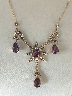 Superb attractive Victorian 9ct gold Amethyst and Pearl Necklace. Very beautiful antique necklace with four large amethyst stones surrounded by pearls and floral motifs, leaves and drops. Very pretty necklace in absolutely excellent condition Marked 9ct. Weight 6.3 grams. Length 22 Inches - 55 cms.   Please Check Sizes And Weights As JEWELLERY IMAGES ARE ENLARGED. Dark areas are reflections on the gold.  BUY WITH CONFIDENCE: I try to accurately describe my items. I never knowingly mis-sell any item, so please read the description carefully. All items are checked by a professional Jeweller for authenticity; however no certificates are provided. If for any reason the item is found not to be genuine or as described a full refund will be given. So please buy with confidence.  Your jewellery wi Antique Amethyst Jewelry, Jewellery Images, Antique Jewelry Victorian, Antique Wedding Rings, Pretty Necklace, Amethyst Stones, Antique Wedding, Victorian Gold, Pretty Necklaces