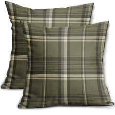 two green plaid pillows sitting next to each other