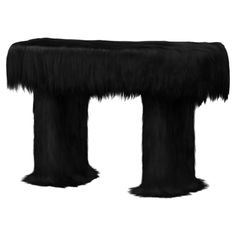 an animal - like bench is shown with long fur on it's legs and feet