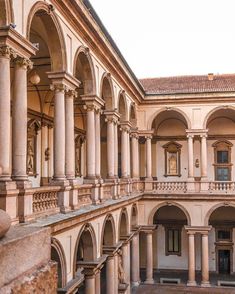 an old building with many arches and pillars