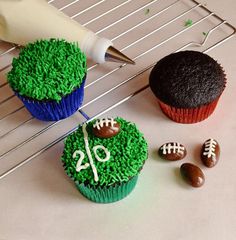 cupcakes decorated with green grass and football decorations