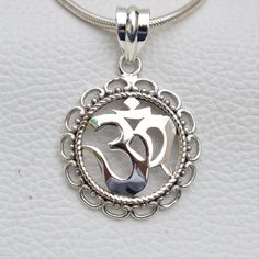 Metal-925 Sterling Silver This One of a kind Om Pendant Add this beautiful one little thing of galactic shine to make you feel unique and to transform your lives.Perfect for any kind of outfit and every occasion. About: 'OM' charms have their own significance. These jewelry pieces can be used for beautification and will also ensure financial as well as emotional satisfaction Wearing an 'OM' charm is said to bring harmony, peace and eternal bliss to the ones who wear them We accept custom and per Round Charm Necklace With Large Pendant As Gift, Nickel Free Pendant Necklace For Festivals, Charm Necklaces With Large Round Pendant For Gifts, Spiritual White Gold Pendant Jewelry, Nickel-free Pendant Necklace For Festivals, Spiritual Engraved Jewelry As Gift, Engraved Spiritual Jewelry For Gifts, Engraved Spiritual Jewelry, Handmade Symbolic Round Pendant Jewelry