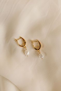 Looking for an earring that will never go out of style? Our Pearl Drop Huggies are just what you're looking for. Featuring a fresh water baroque pearls draped from gold-filled huggies = a timeless look. Includes two 24k gold-filled huggies + fresh water baroque pearl Size is approx. 19 x 13mm All materials are lead & nickel free Handmade Gold Jewellery, Pearl Size, Pearl Drop, Baroque Pearls, Jewelry Handmade, Go Out, Out Of Style, Personalized Jewelry, Fresh Water