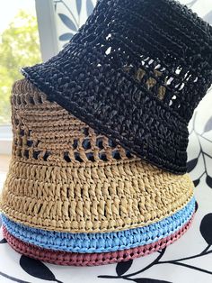 The raffia crochet bucket hat is the epitome of a versatile summer accessory. With its lightweight and breathable design, it effortlessly transitions from a chic sun hat for lounging by the beach to a practical straw gardening hat for tending to your plants with style. Its intricate crochet pattern adds a touch of bohemian charm, making it a fashionable choice for any summer outing. Either you're strolling through the farmer's market or enjoying a picnic in the park, this knit bucket hat provides both sun protection and a laid-back, slouchy vibe, ensuring you stay cool and stylish all season long. Color: multiple One size Materials: raffia Processing time: Up to 5 business days Delivery time: 7-14 business days Personalization: I can create a product according to your wishes, in the desire Spring Straw Bucket Hat, Casual Crochet Summer Hat, Casual Beach Sun Hat Bucket Shape, Casual Crochet Straw Hat, Casual Crochet Sun Hat For Summer, Casual Handmade Straw Bucket Hat, Summer Bucket Hats For Beach Season, Open Weave Brimmed Hat For Vacation, Summer Straw Hat With Open Weave