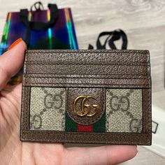 Authentic Gucci Ophidia Card Case, Like New With Tags Condition: Like New, Only Used Once, No Signs Of Wear, No Hairline Scratches, Could Pass As Brand New For Gifting! Comes With Original Dust Pouch, Original Box With Original Tags And Care Cards, Original Limited Edition Packaging And Gucci Ribbon For The Ultimate Gift! Designer Card Holder With Interior Slots, Luxury Multicolor Wallets With Card Slots, Designer Brown Card Holder For Gift, Designer Brown Card Holder As Gift, Designer Gold Wallet With Card Slots, Designer Gold Wallets With Card Slots, Designer Wallets With Interior Card Slots, Designer Beige Wallets For Gift, Designer Beige Wallets For Gifts