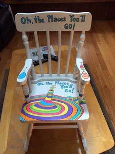 a child's wooden chair with a sign on it that says oh the places you'll go