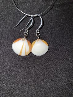 Hand made, hand picked from brevard county beaches Orange Earrings For Beach With Pierced Ears, Orange Earrings For Beach, Orange Drop Earrings For Beach, Orange Drop Earrings For The Beach, Unique Nickel-free Earrings For Beach, Unique White Beach Earrings, Nickel-free Round Earrings For Beach, Handmade Round Earrings For Beach, Orange Dangle Jewelry For Beach