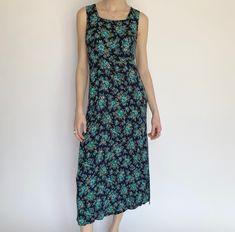 "Product Details: Adorable vintage blue floral dress. Fabric does stretch, can different sizes depending on how baggy you want the fit. Perfect picnic or summertime dress! Lays about mid-calf. Super lightweight and airy.  Brand: Unknown Material: Unknown Marked Size: Unknown Measurements: Bust: 16.5\" Waist: 16\" Height: 16.5\" Length: 50\" Amazing condition. Model: 5'9\" All sales are final." Blue Bohemian Floral Dress With Ditsy Print, Bohemian Blue Ditsy Floral Dress, Blue Maxi Dress With Ditsy Floral Print For Summer, Blue Floral Print Maxi Dress, Casual Blue Maxi Dress With Ditsy Floral Print, Blue Summer Dress With Ditsy Floral Print, Blue Ditsy Floral Print Maxi Dress For Garden Party, Bohemian Blue Midi Dress With Ditsy Floral Print, Blue Midi Dress With Ditsy Floral Print For Summer