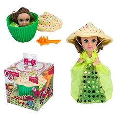 the doll is wearing a green dress and hat with cupcakes in front of it