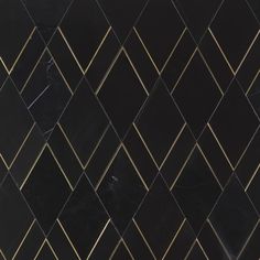 a black and gold tiled wall with diamond shapes