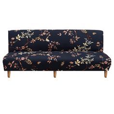 a blue floral couch with wooden legs