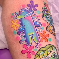 an image of a colorful tattoo on someone's leg