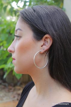 "Everyday minimalist hoop earrings, made of highly polished 925 sterling silver. Great women's earrings to spoil yourself with. They are large but not too much. This lovely dainty silver hoops fits for everyday wear or evening night out. This pair of earrings are simple yet noticeable. Comfortable snap-hinged closure that consists of thin wire post on a hinge on one end of your earring and a Y-shaped piece on the other end. The earring closes when the post snaps down into the Y-shaped piece. Perfect gift for a loved one or yourself. ◆ DETAILS Hoop Earrings are fully made from 925 Sterling Silver Diameter: 51mm (~2\") Thickness: 2.3mm = 0.09\" Closure: Snap-hinged closure ✤ View More Hoop Earrings https://www.etsy.com/shop/TwoLiliesDesigns?section_id=35878863 ✤ View Dangle & Drop Earrings h Hoop Earrings Aesthetic, Earrings Silver Hoops, Simple Silver Earrings, Hoop Jewelry, Hoop Earrings Large, Large Silver Hoop Earrings, Silver Circle Earrings, Simple Hoop Earrings, Earrings Aesthetic