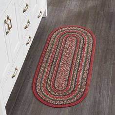 a bathroom rug is shown on the floor in front of a sink and cabinet doors