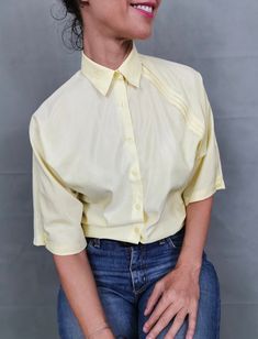 "Vintage blouse for women size S | Light yellow blouse with front pleats. Very cute blouse, great for summer. Composition: 65% cotton, 35% polyester. Size on tag: 36. Measurements of the vintage blouse for women lying flat: Armpit to armpit: 50 cm | 19.7\" Length: 60 cm | 23.6\" Shoulders: 40 cm | 15\" In excellent vintage condition. My shop is dedicated to vintage blouses exclusively, so have a look for more beautiful options: https://etsy.me/2PovJic" Cheap Vintage Yellow Shirt, Cheap Yellow Semi-stitched Blouse, Yellow Spring Office Tops, Casual Yellow Office Shirt, Yellow Summer Office Shirt, Summer Cotton Office Tops, Summer Office Cotton Tops, Summer Cotton Top For Office, Casual Yellow Office Blouse