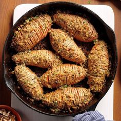 some food is cooking in a pan on the table