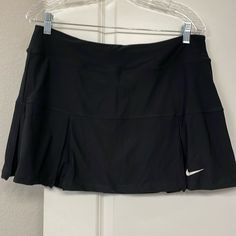 Women’s Nike Tennis/Golf Skirt Nwt. Black. Size L Measurements Waist 16-1/2” Length 14” Casual Nike Tennis Skirt, Sporty Black Pleated Bottoms, Black Sporty Pleated Bottoms, Black Pleated Sporty Bottoms, Nike Casual Sports Skirt, Casual Nike Sports Skirt, Sporty Black Pleated Skort, Black Mini Skirt For Sports, Spring Season, Nike Fitted Sporty Skort