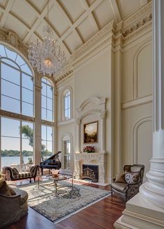 an elegant living room with chandelier and piano