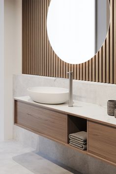 a bathroom with a sink, mirror and wooden paneled wall in the back ground