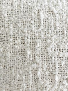 close up view of the texture of a white carpet