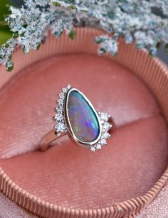 In ancient Rome, it was believed that opal brings love and hope. We have no doubt that it’s exactly the gem that symbolizes a strong alliance. We have created a custom engagement opal ring with diamonds for those who value love and reliability in the relationship. Creating the unique design of the ring we wanted to combine two symbols: infinity and Yin Yang, which are so meaningful for engagement rings.The best addition to dream ring is white gold and sparkling diamonds that give goddess ring a Opal Diamond Engagement Ring, Diamond Engagement Ring Gold, Black Opal Engagement Ring, Unique Opal Ring, 14k Gold Opal Ring, Goddess Ring, Opal Promise Ring, Montana Sapphire Engagement, Montana Sapphire Engagement Ring