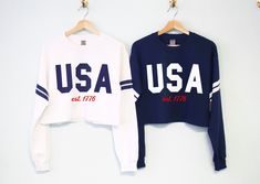 USA est. 1776 Patriotic 4th of July Cropped Sweatshirt for women The perfect sweater for any Independence day party! Shirt Colors Available: White with Navy Blue Stripes, Navy Blue with White Stripes, Mauve with White Stripes Women's Sizes Available: S, M, L, XL, XXL These run true to size. We recommend sticking with your normal shirt size, unless you are in between sizes or prefer a looser fit then order a size up. Usa Shirts Vinyl, Patriotic Tops With Letter Print For Fall, Patriotic Fall Tops With Letter Print, Patriotic Letter Print Tops For Fall, Long Sleeve Cotton Tops For 4th Of July, Cotton Long Sleeve Top For 4th Of July, Patriotic Crew Neck Top For Fall, 4th Of July Long Sleeve Letter Print Sweatshirt, Long Sleeve Letter Print Sweatshirt For 4th Of July