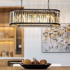 a chandelier hanging over a dining room table