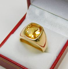 Gemstone: Golden Citrine Treatments: None Measures: 12x10mm Weight: 3.72 carats Clarity: Eye clean Cut: Rectangle cushion cut Metal: Shown in 18K yellow gold Weight: Approx. 20 -22 grams Ring size: This ring is available in all sizes from a low of 5 to a high of 12 This is as fine and elegant a man's ring as you will ever find. The perfect blend of a fine gemstone matched up with a clean classic 18K yellow gold ring. Good solid weight, nicely distributed to give the ring an even weight so that i Yellow Stone Ring Men, Yellow Sapphire Ring Men Gold, Gold Ring With Stone For Man, Yellow Sapphire Ring Men Design, Men Gemstone Ring Design, Classic Citrine Signet Ring For Anniversary, Classic Yellow Hallmarked Signet Ring, Yellow Signet Ring With Polished Finish For Formal Occasions, Classic Gold Citrine Signet Ring