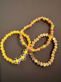 Set of 3 bracelets made with stretchy elastic and yellow, orange, and gold beads. Sizing may vary slightly. Owl Bracelet, Orange Bracelet, White Bracelets, Stretchy Bracelets, Bracelets Handmade Beaded, Pink Bracelet, Blue Bracelet, Gold Beads, Bracelet Set