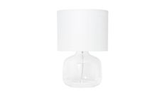 a clear glass table lamp with a white shade on the base and a white fabric lampshade