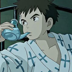 an anime character drinking from a teapot while sitting on a bed in front of a window