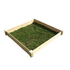 a wooden box with grass in it